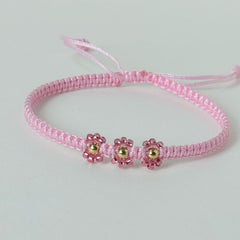 pulsera tejida en hilo rosado con bolas de oro 18k 